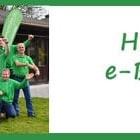 Gruppe von e-Bike Experten in grünen Hemden bei e-motion